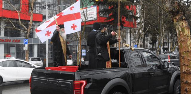 street blessing with Holy Water in Orthodox Georgia